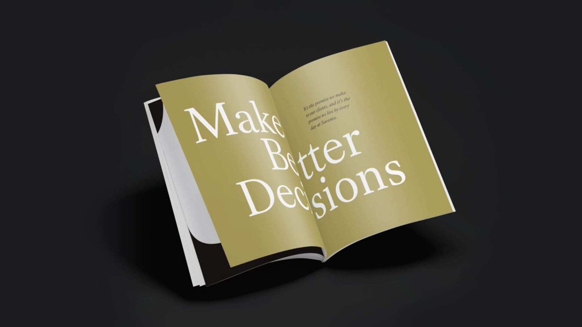 An open book displayed at an angle on a black background. The pages feature large text that reads "Make Better Decisions." A smaller text below states, "It's the promise we make to our clients, and it's the promise we live by every day at